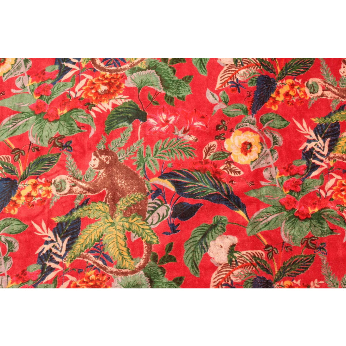 Close-up of deep red cotton velvet with blue and orange floral print – rich texture and detail