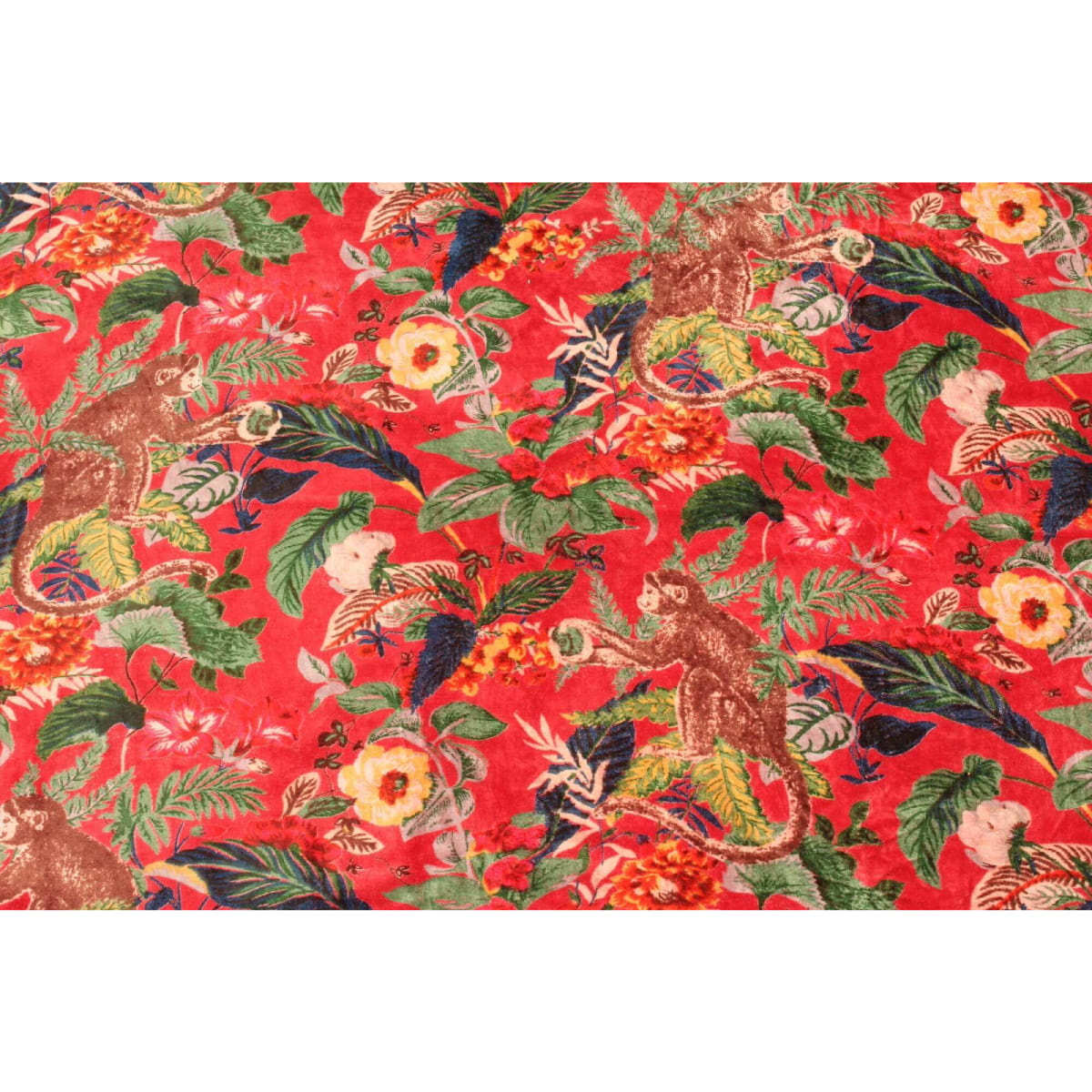 Hand-printed cotton velvet in deep red with blue and orange floral design – flatlay view